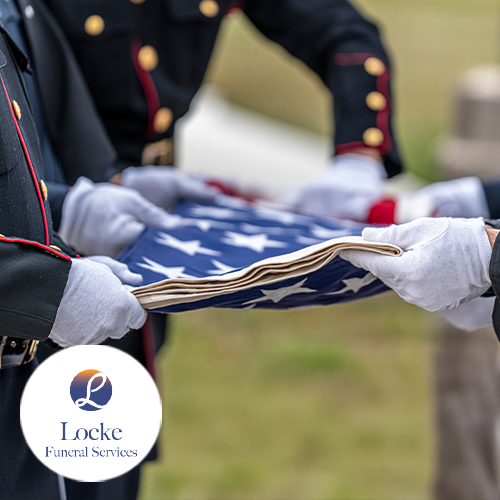 Members of the military holding American flag in their hands in uniform